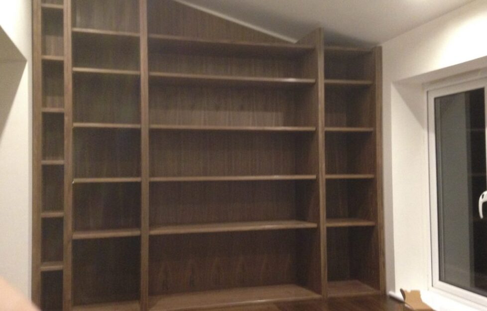 bespoke carpentry bookshelf and desk installation